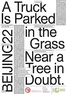 展览—— "A truck is parked in the grass near a tree in doubt"